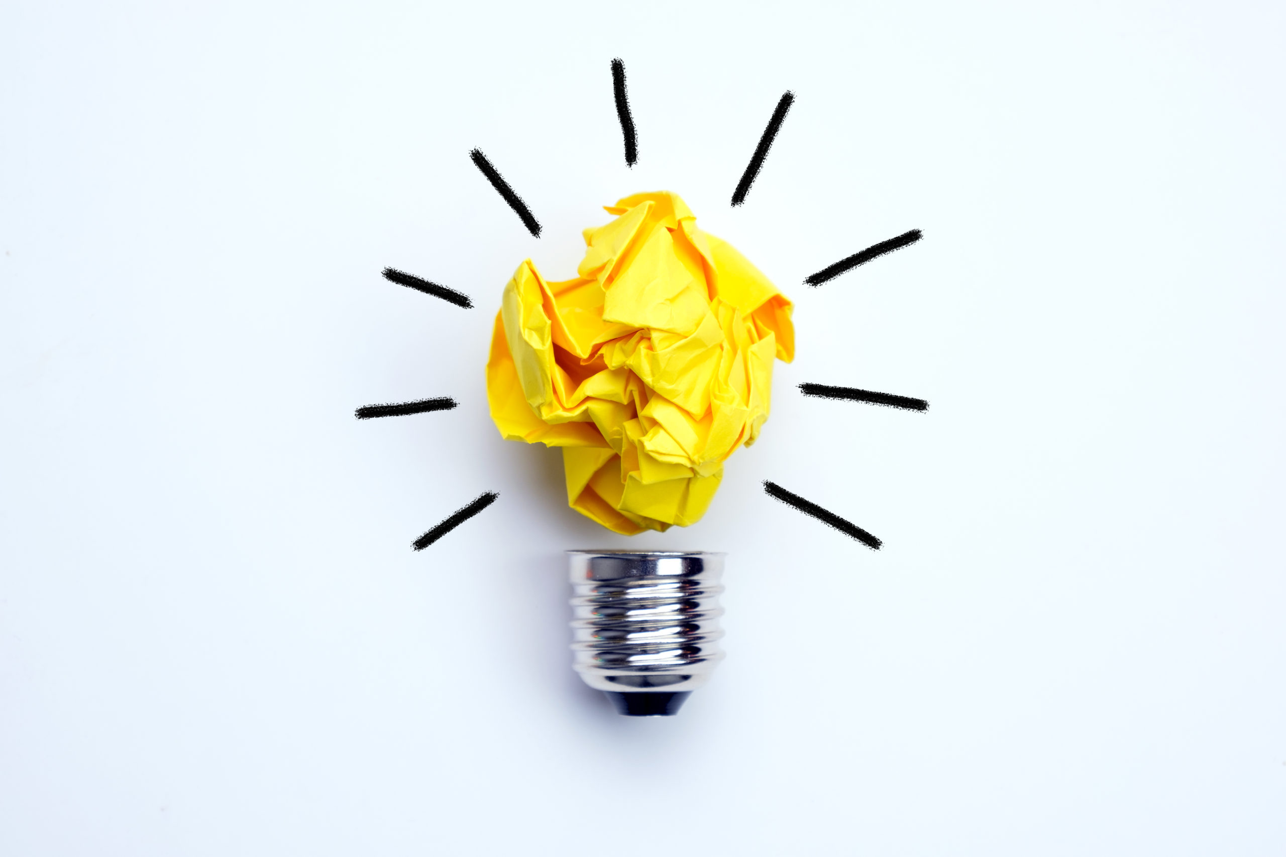 Great idea concept with crumpled yellow paper light bulb